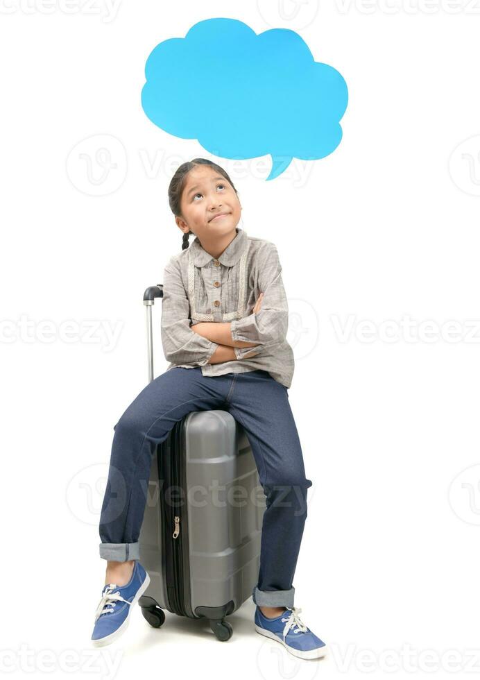 Girl traveler sit on suitcase and thinking with speech bubble photo