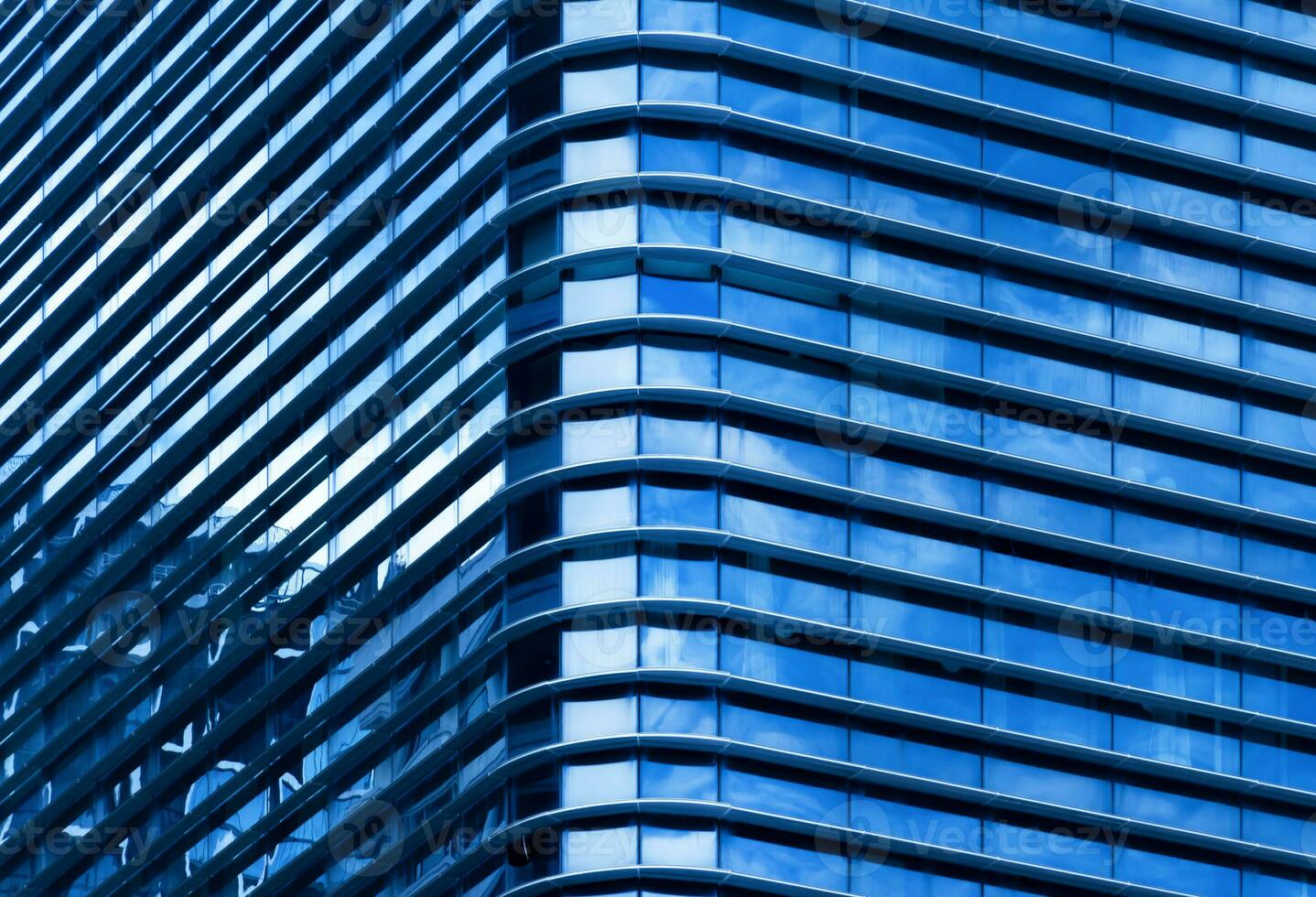 Modern office building with blue glass window photo