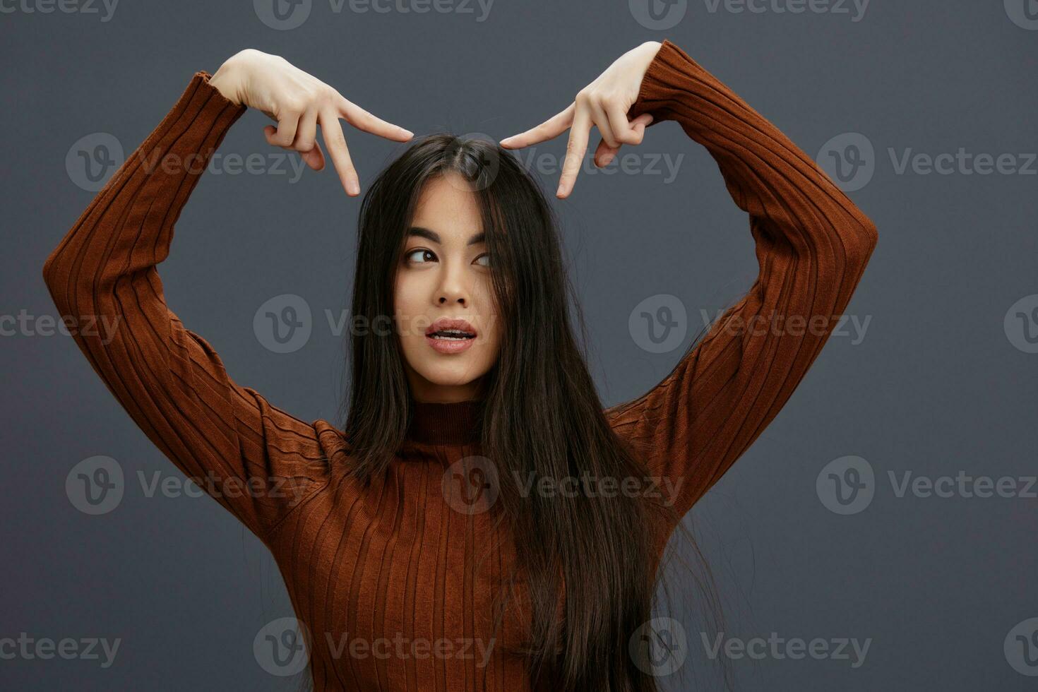 beautiful woman hand gestures brown sweater fashion Lifestyle photo