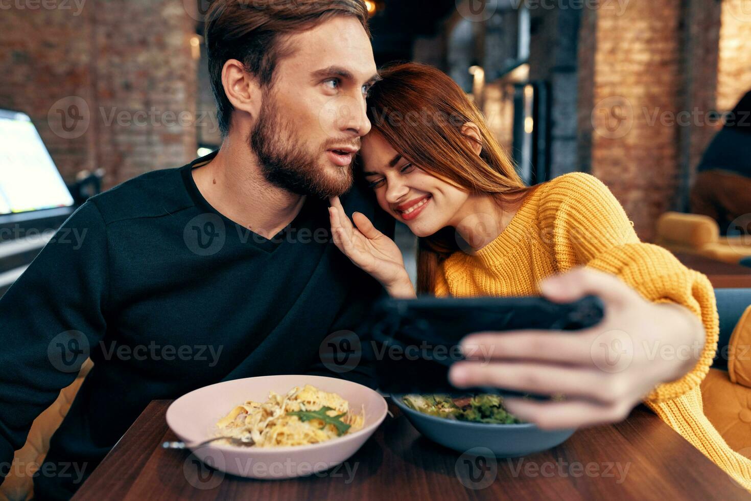 cheerful young couple restaurant leisure entertainment communication photo