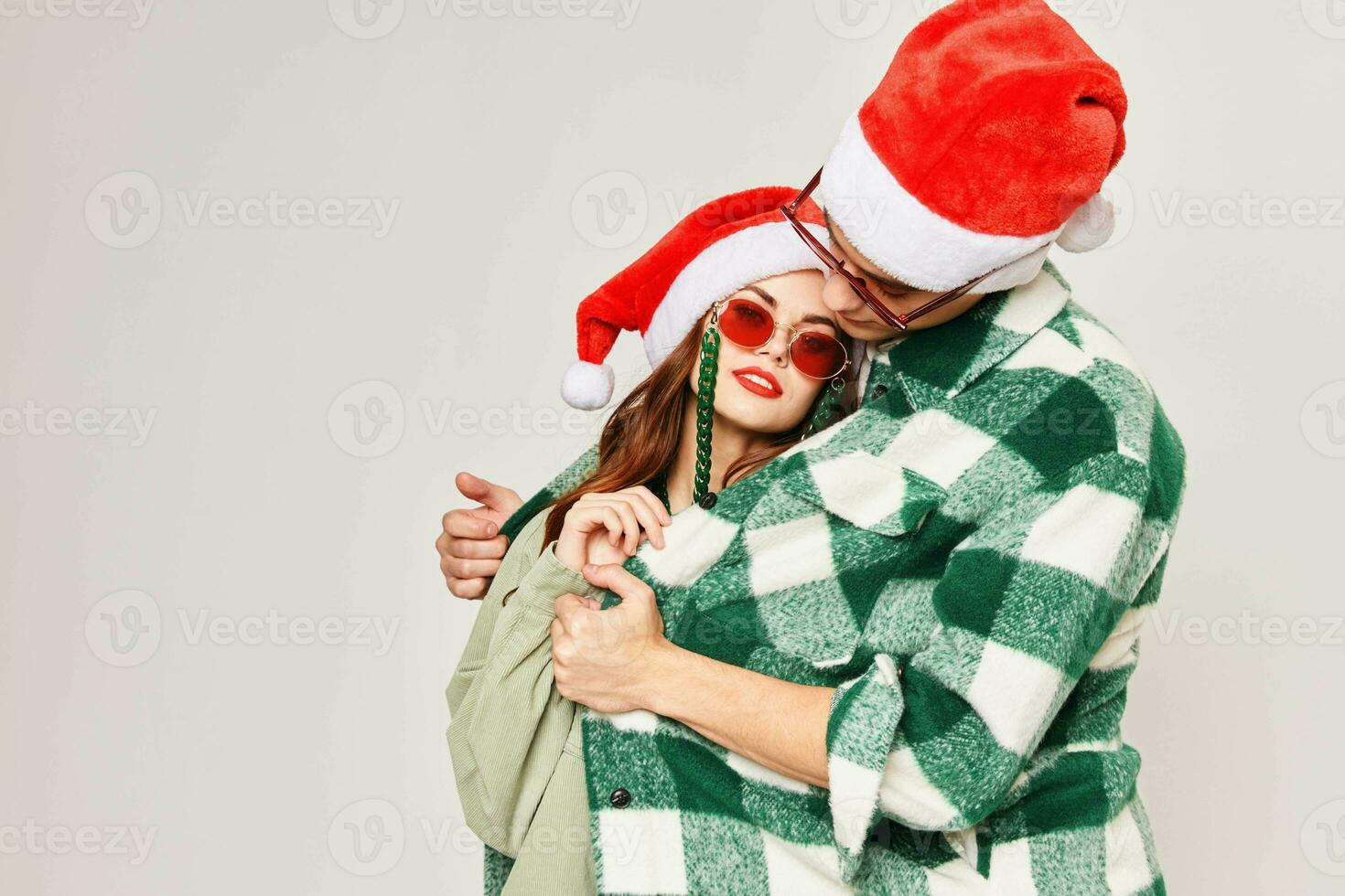man warms woman hugs new year holiday sunglasses photo