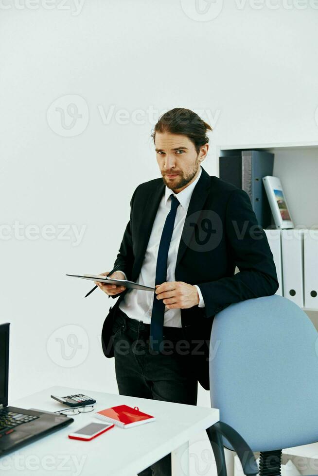 man in a suit holding a phone telephone office executive photo