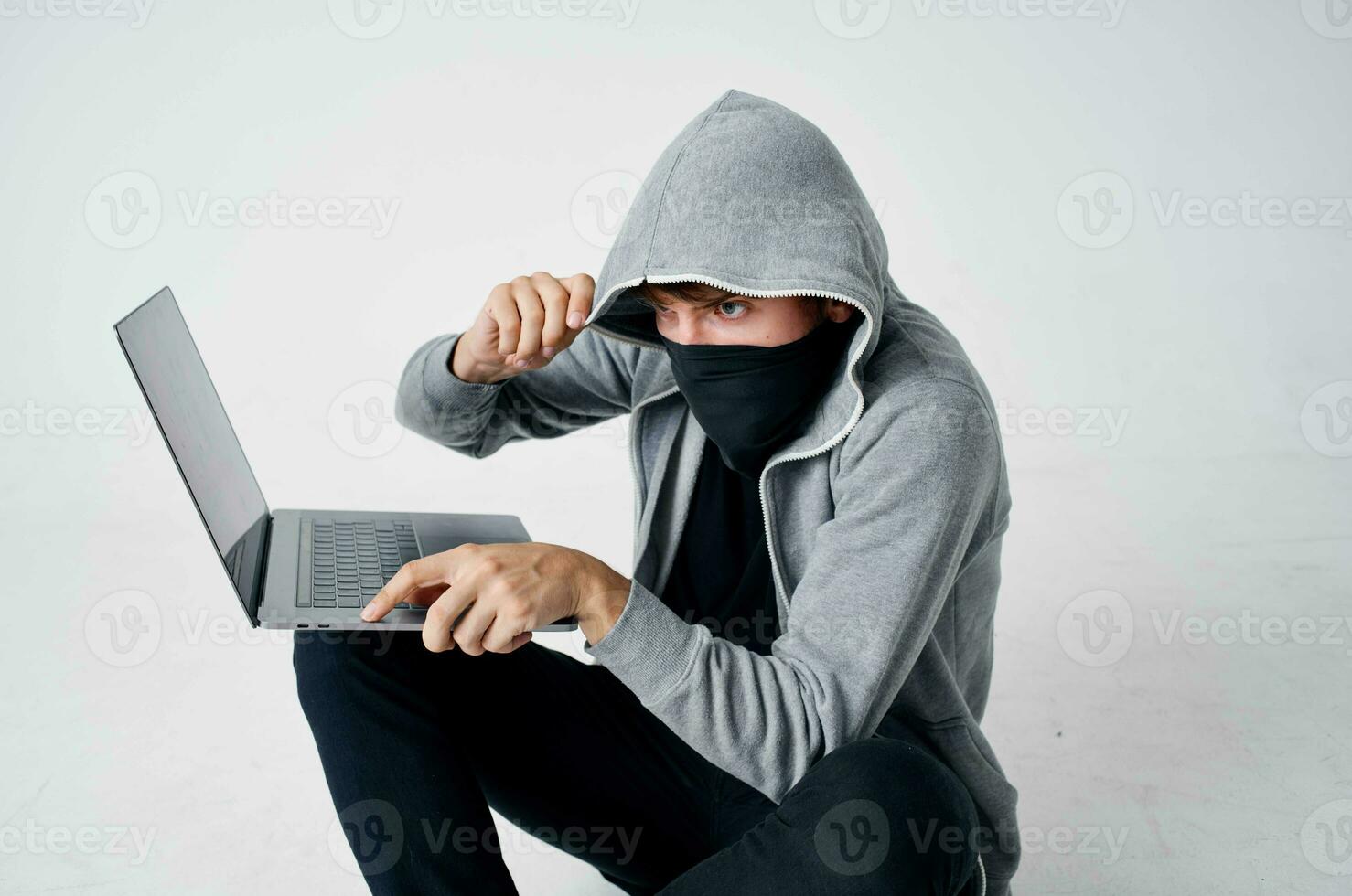 male thief hooded head hacking technology security isolated background photo