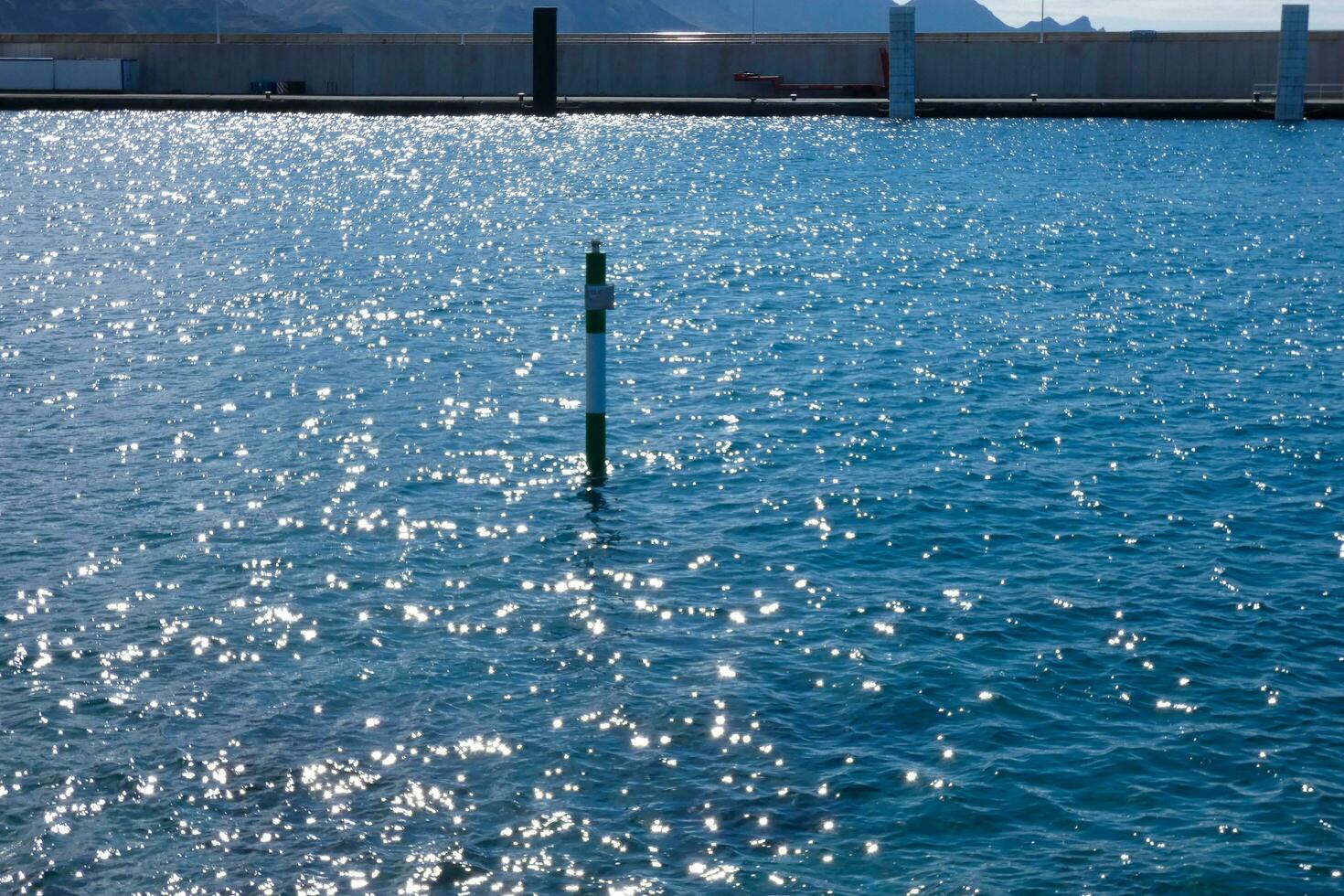 a rod to measure the height of water in a harbour photo