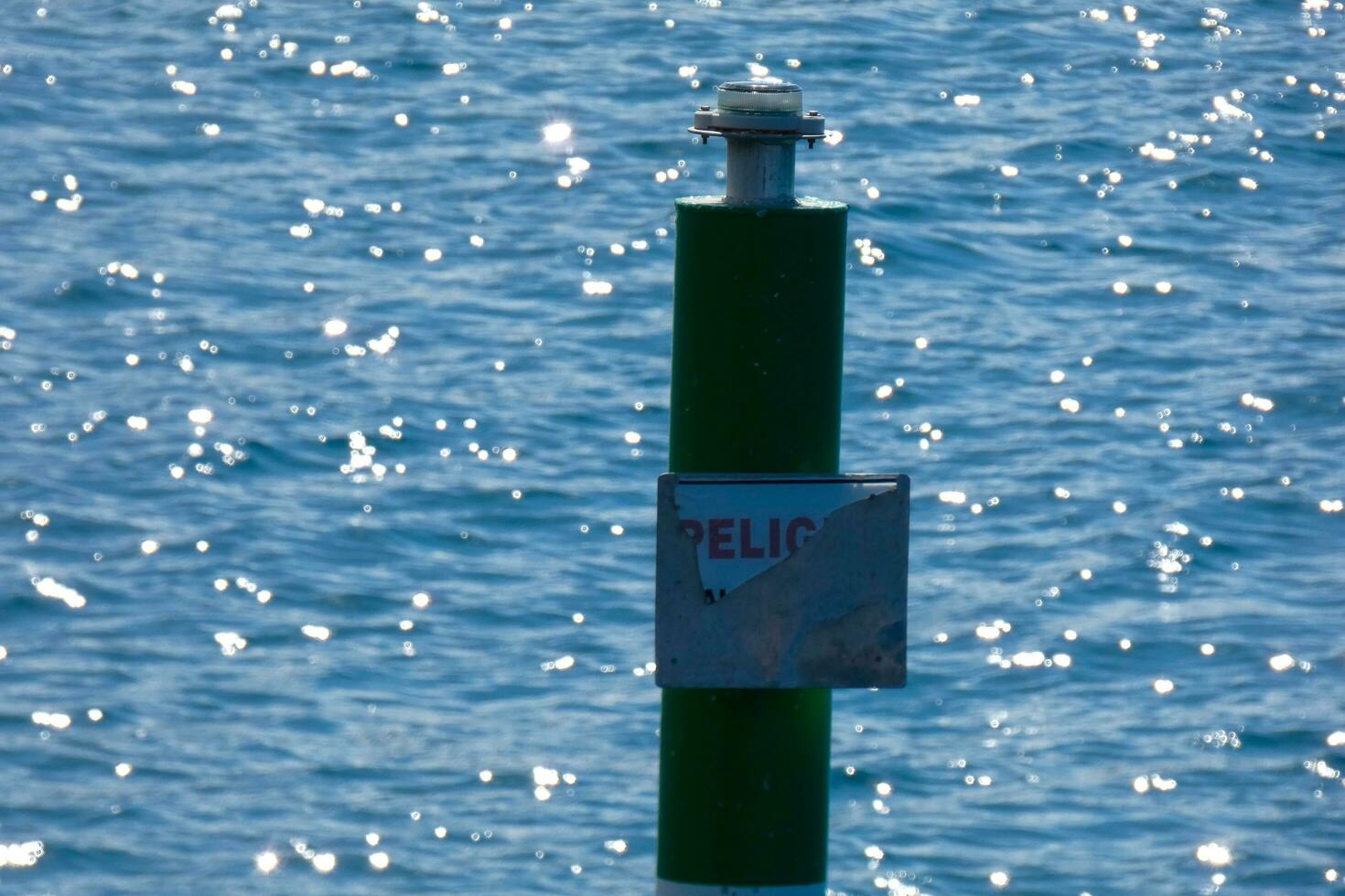 a rod to measure the height of water in a harbour photo
