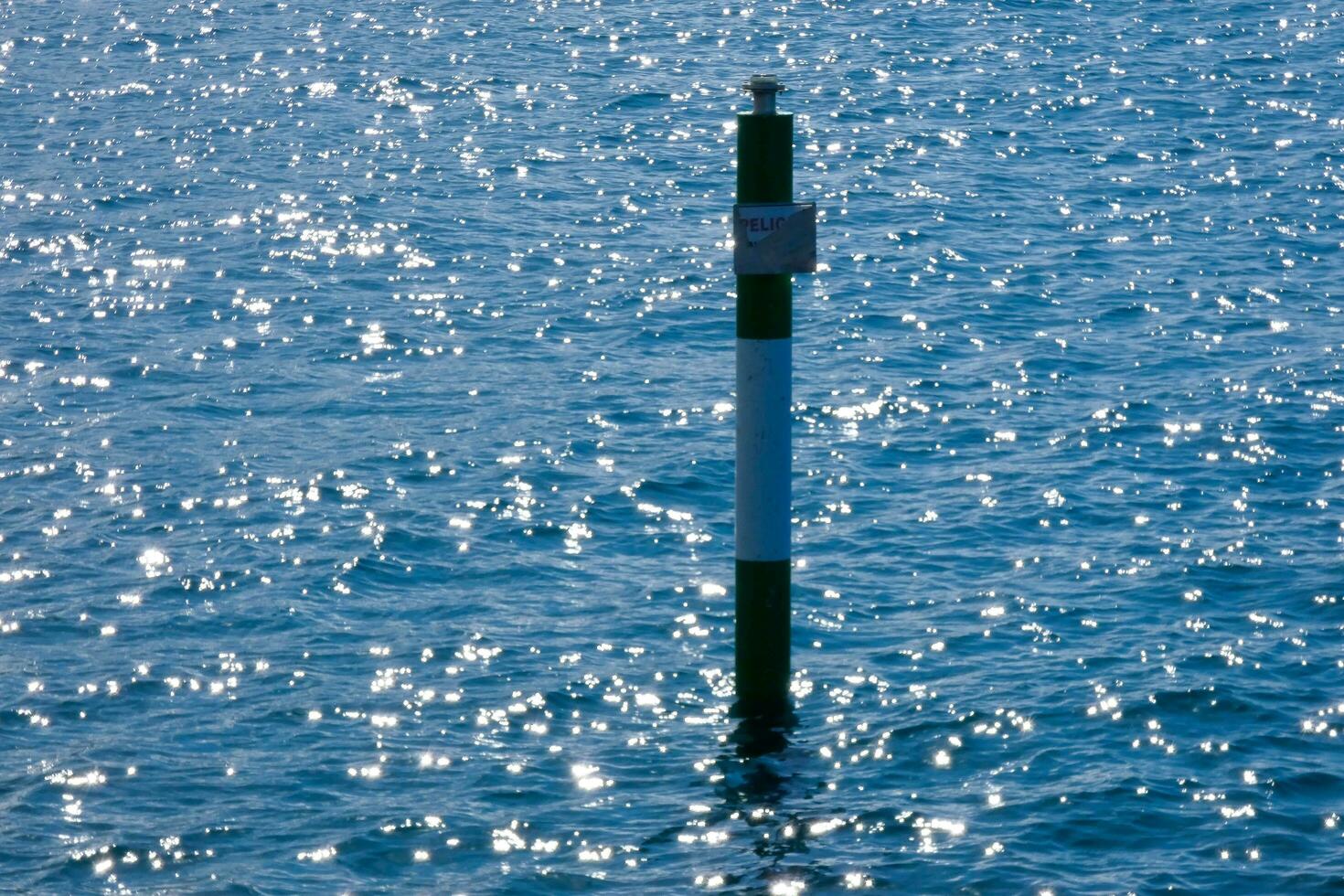 a rod to measure the height of water in a harbour photo