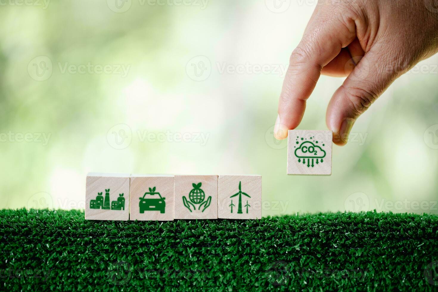 Companies are targeting net zero greenhouse gas emissions. Carbon credit concept.Tradable certificate to drive industry in direction of low emissions in efficiency cost. Wooden cubes with decrease CO2 photo