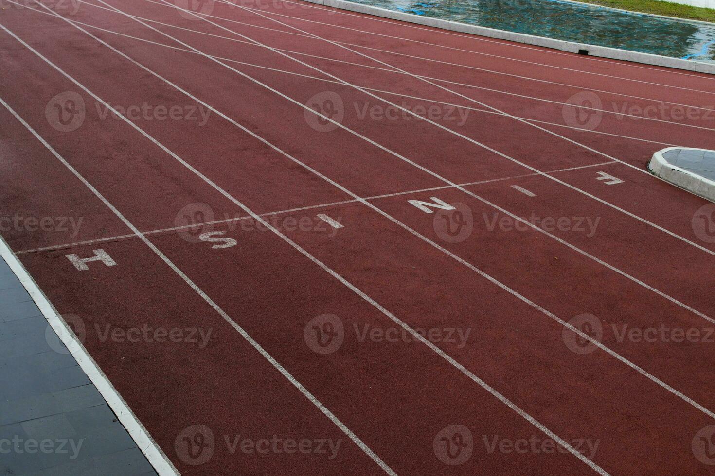 Finish line on running track photo