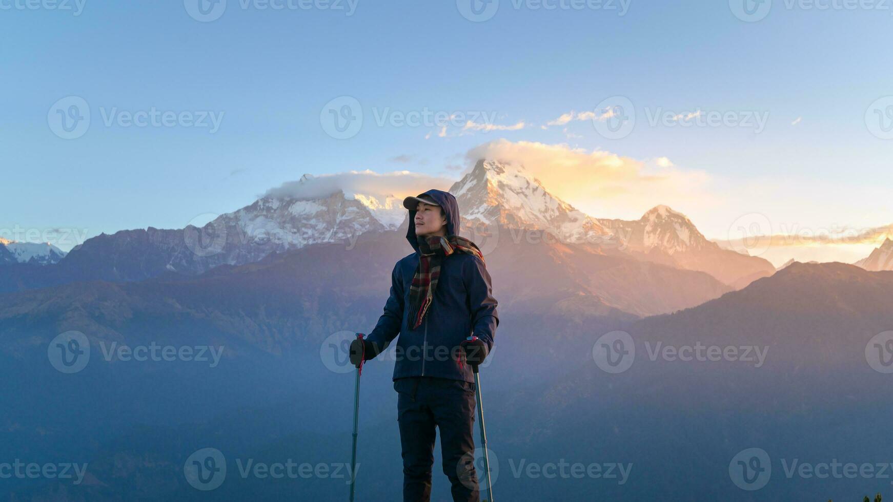 A young traveller trekking in Poon Hill view point in Ghorepani, Nepal photo