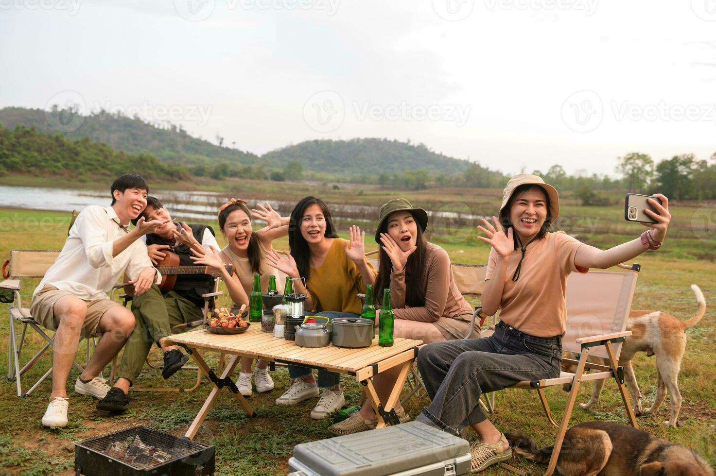 Group of young  Asian people are enjoy camping in natural campsite photo