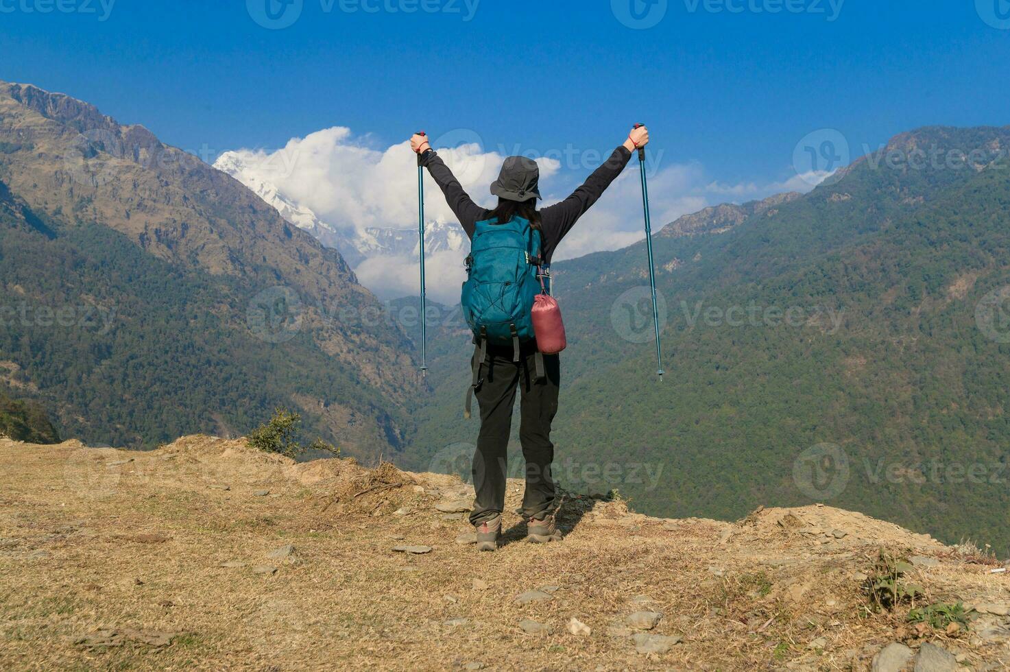 A young traveller trekking on forest trail , Nepal photo