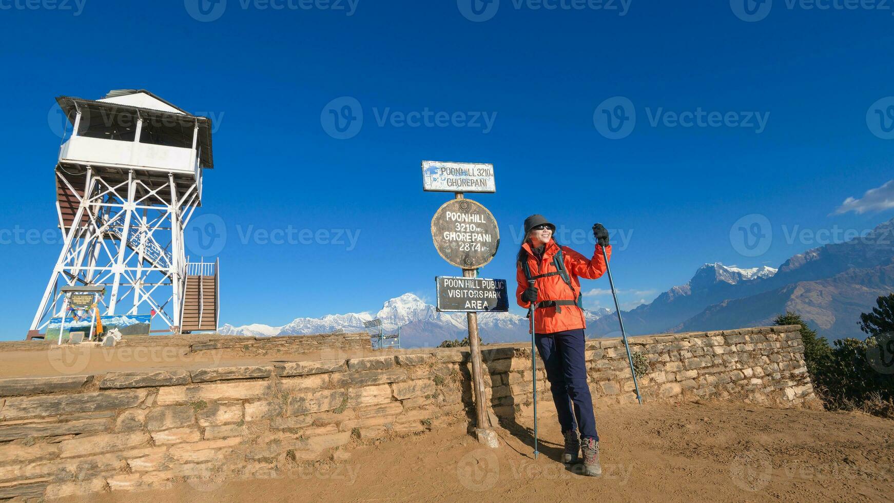 A young traveller trekking in Poon Hill view point in Ghorepani, Nepal photo