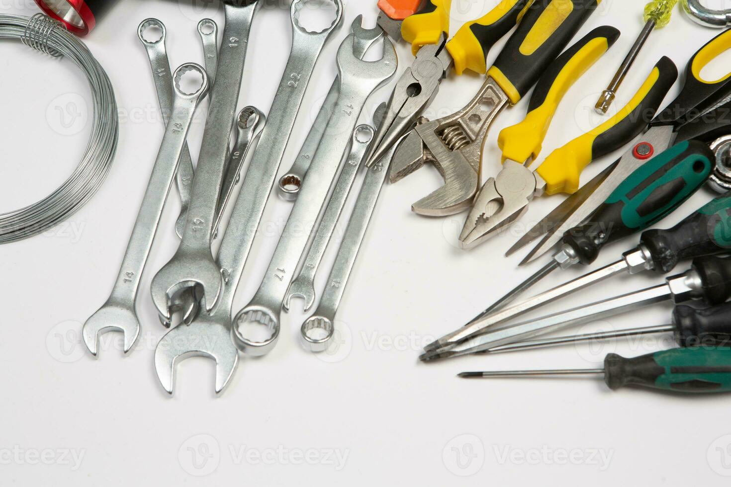 Set of tools for repair in a case on a white background. Assorted work or construction tools. Wrenches, Pliers, screwdriver. Top view photo