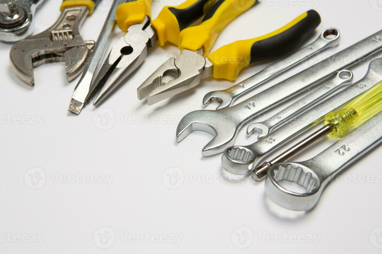 Set of tools for repair in a case on a white background. Assorted work or construction tools. Wrenches, Pliers, screwdriver. Top view photo