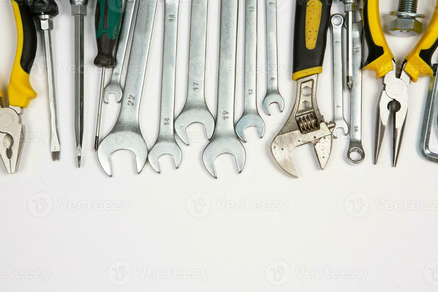 Set of tools for repair in a case on a white background. Assorted work or construction tools. Wrenches, Pliers, screwdriver. Top view photo