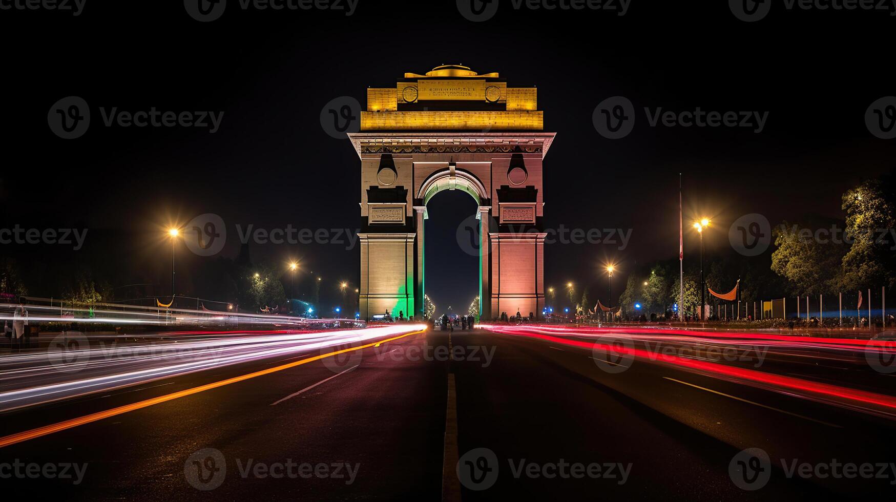 India gate at night with multicolored lights. This landmark is one of the main attractions of Delhi and a popular tourist destination. photo
