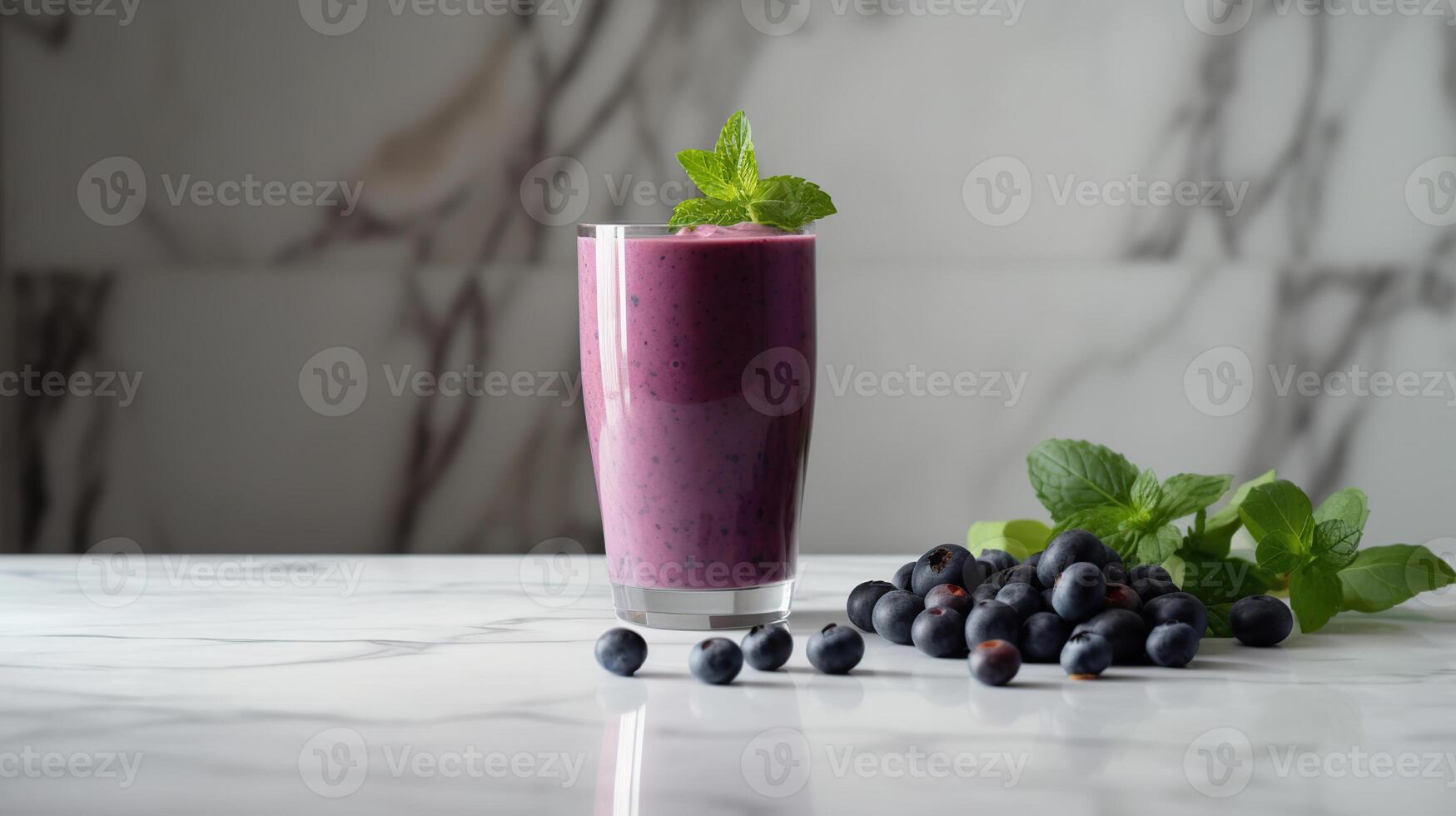 Glass of blueberry smoothie with mint and fresh berries. photo