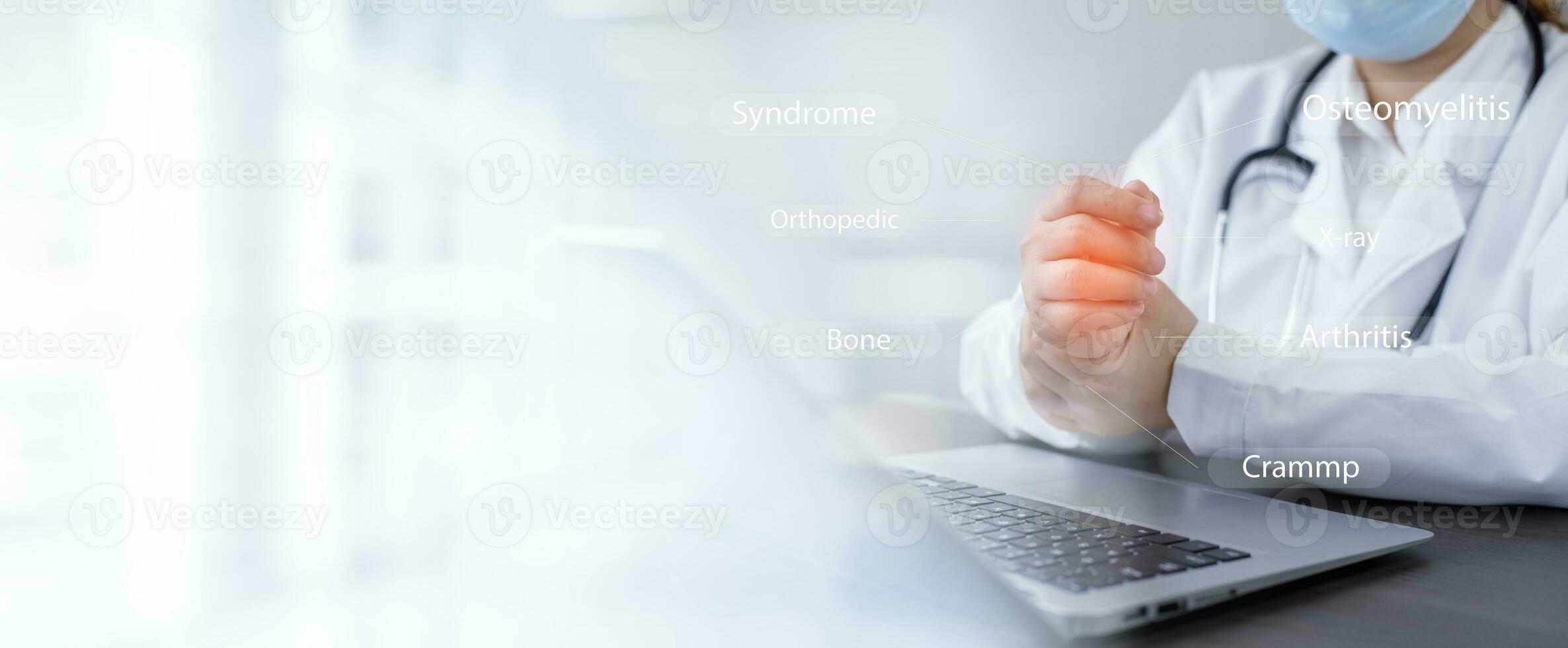 Consulting with the patient showing results on a laptop from Home, Doctor advise painful wrists caused by long hours working on a laptop computer, Carpal tunnel syndrome, rheumatism, hand numbness photo