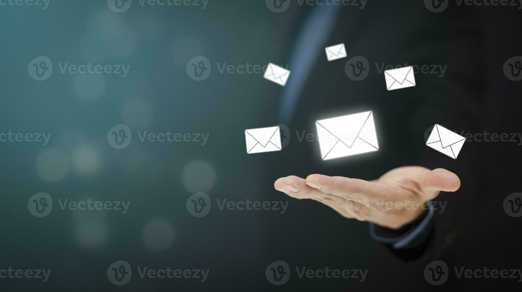 Businessman hand holding e-mail icon letter on a touch screen interface, virtual postal envelope, concept of spam email, internet and networking, Contact us newsletter email and protect your personal. photo