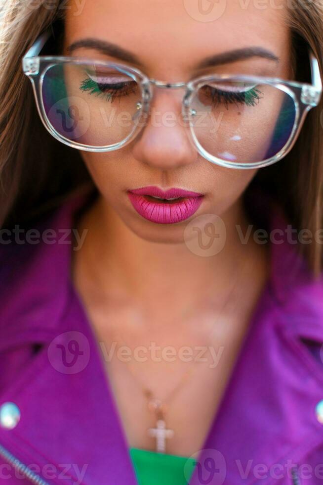 Female face with glasses closeup photo
