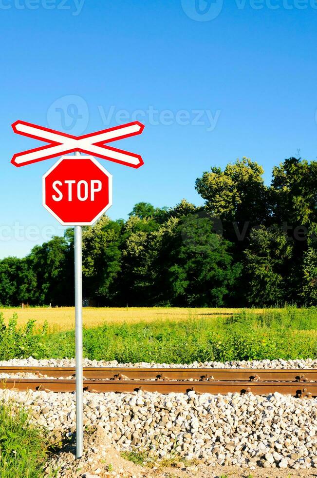 Stop sign on rail photo