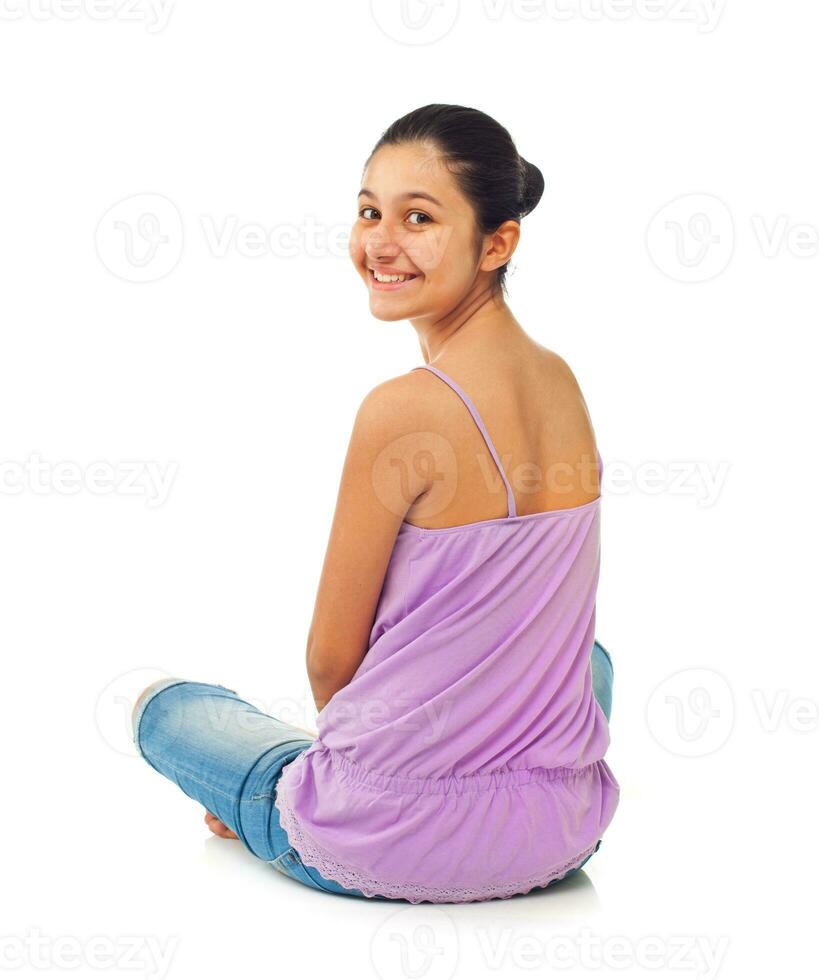Sitting teenage girl from behind photo