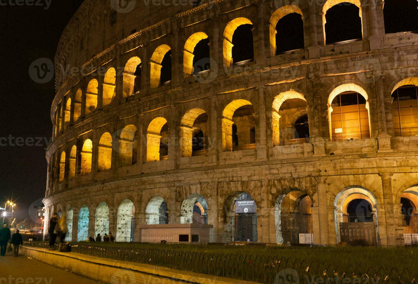 Colosseum at night in Rome, Italy photo