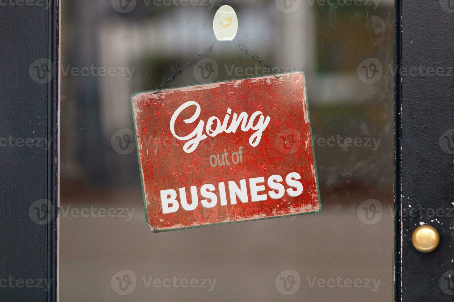 Going out of Business sign in a window photo