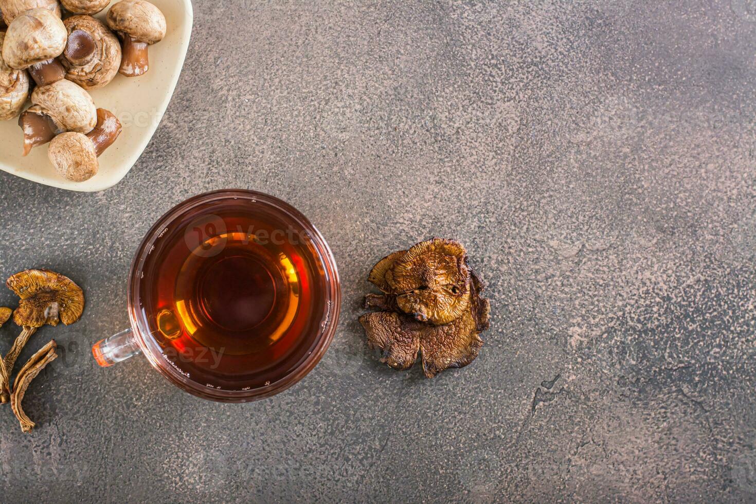 Organic mushroom tea in a cup for alternative herbal medicine top view photo