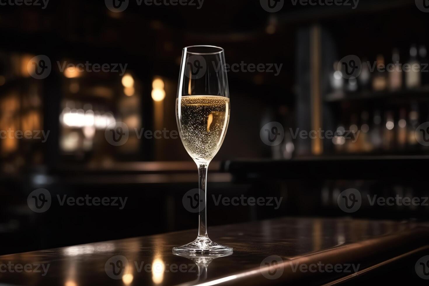 A glass of the champagne or white wine is placed on the counter with background of luxury bar place. photo