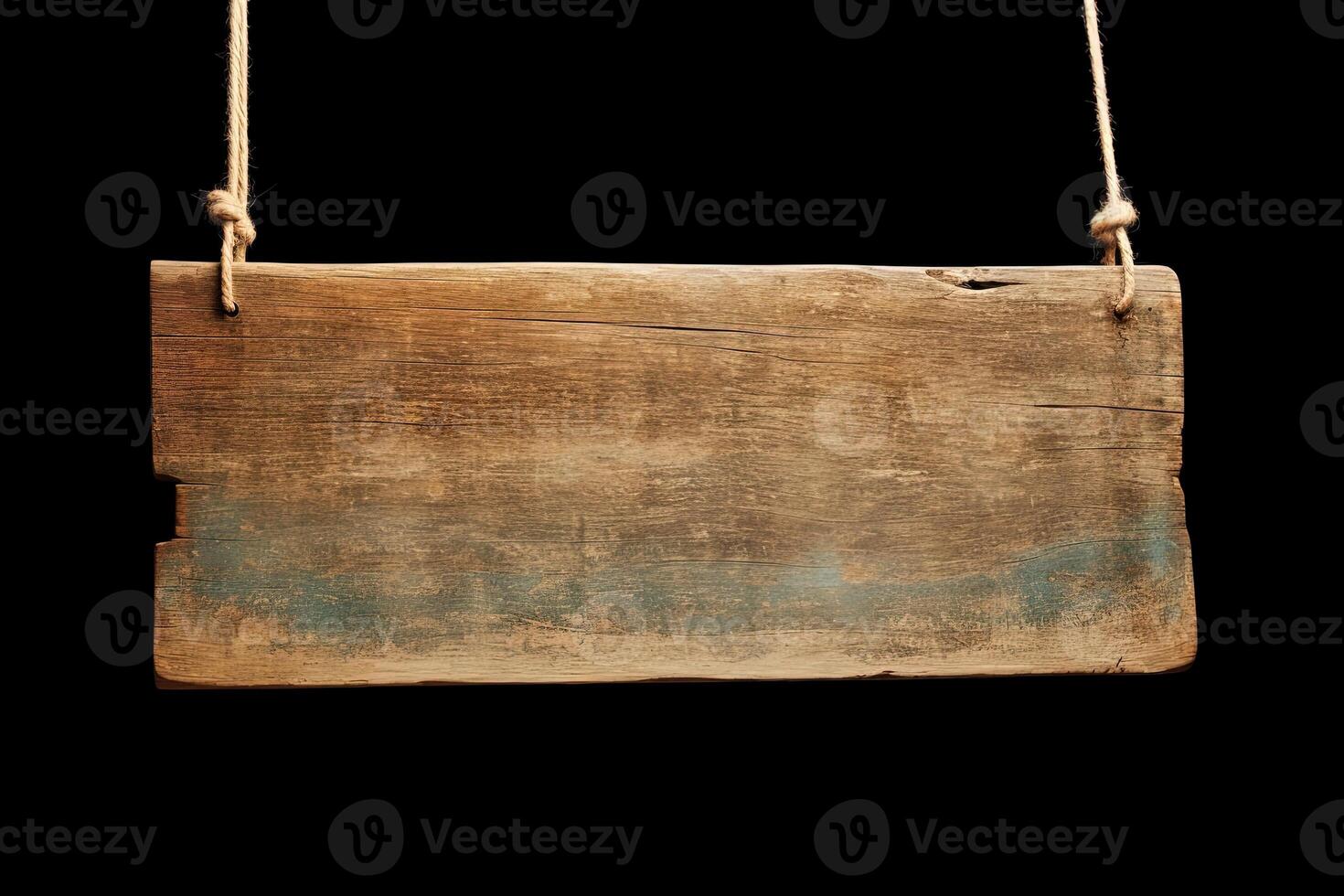 Wooden sign plain hanging from rope isolated on black background. photo