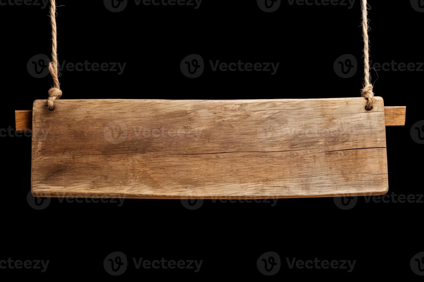 Wooden sign plain hanging from rope isolated on black background. photo