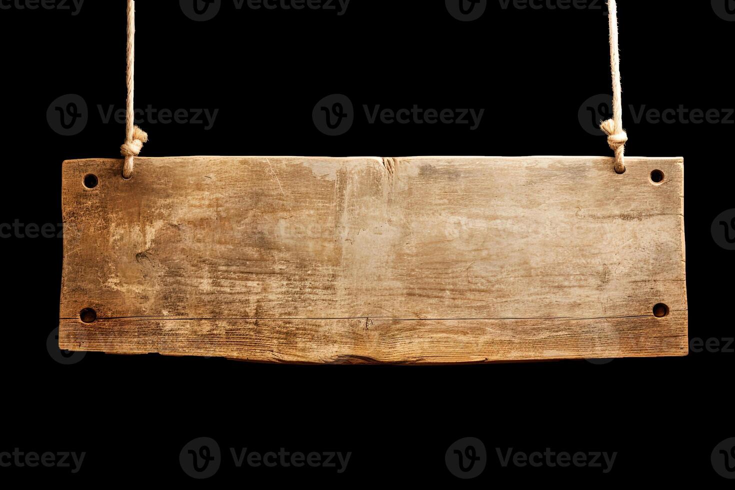 Wooden sign plain hanging from rope isolated on black background. photo