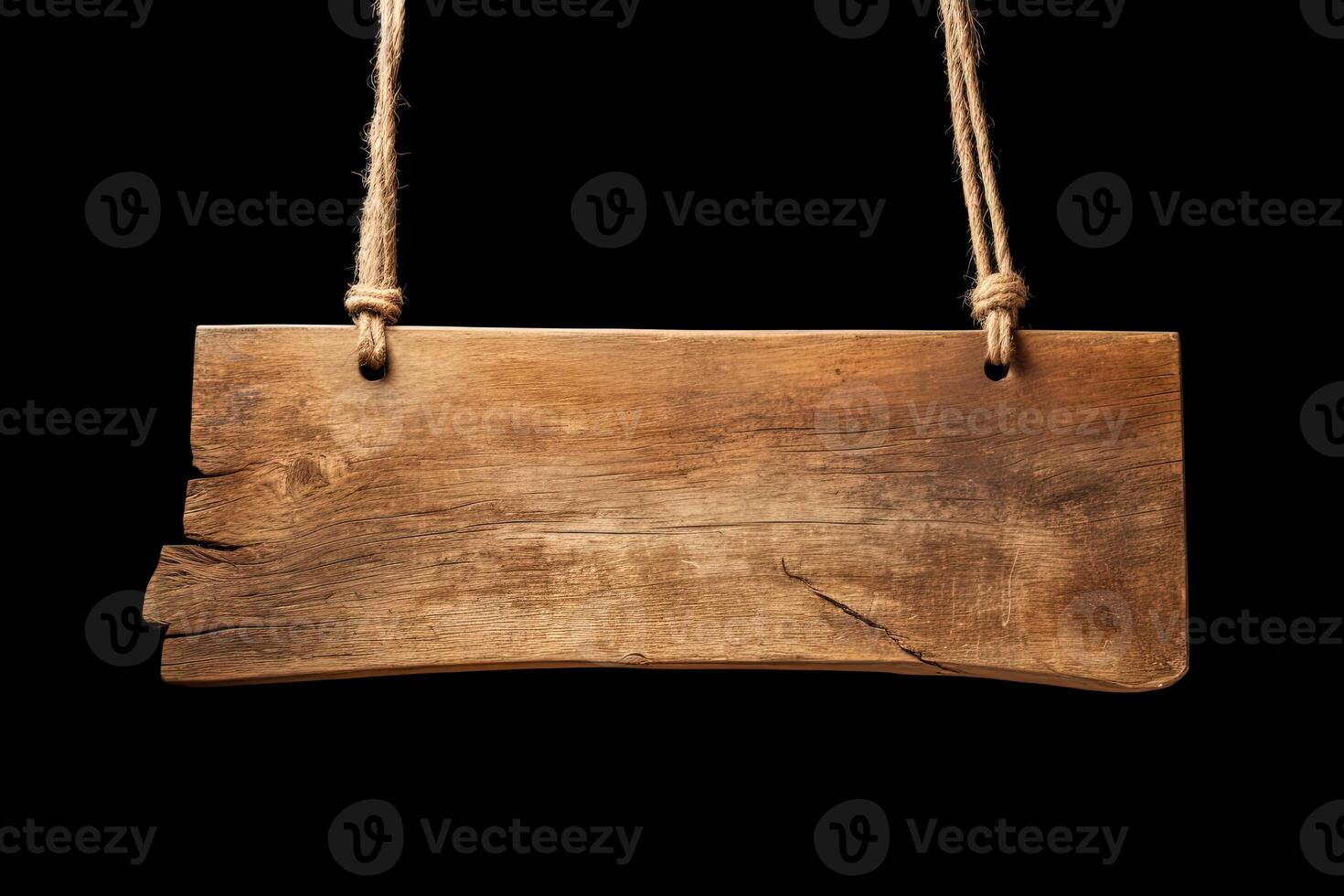 Wooden sign plain hanging from rope isolated on black background. photo