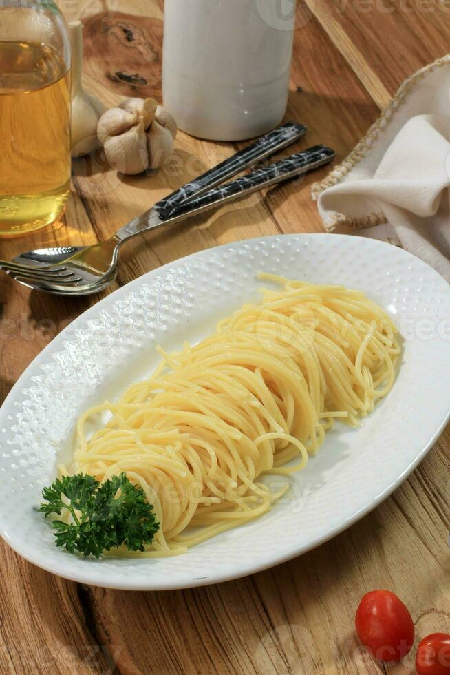 Fresh Boiled Angel Hair Spaghetti on White Plate, photo