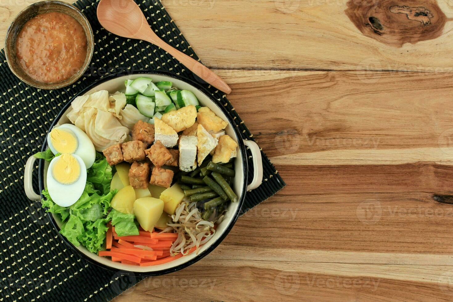 Gado Gado Indonesian Mix Salad from Boiled or Steam Vegetable Served with Peanut Sauce. photo