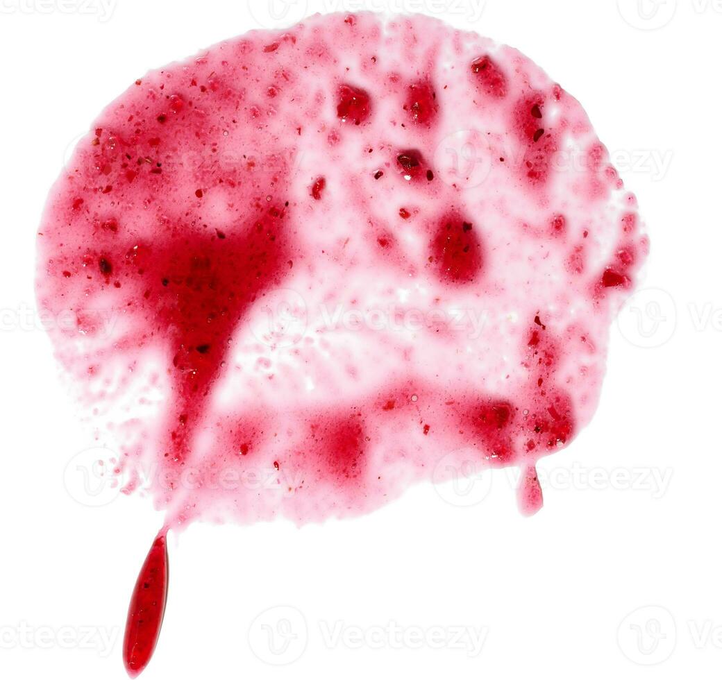 Spilled red raspberry jam on a white isolated background, top view photo