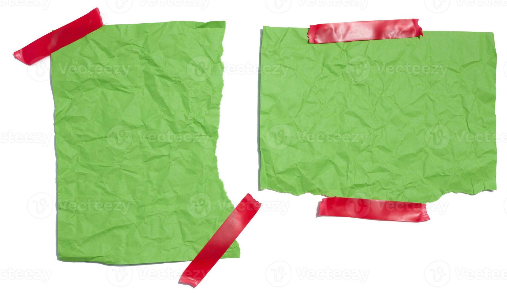 Green torn pieces of paper taped with electrical tape on a white isolated background photo