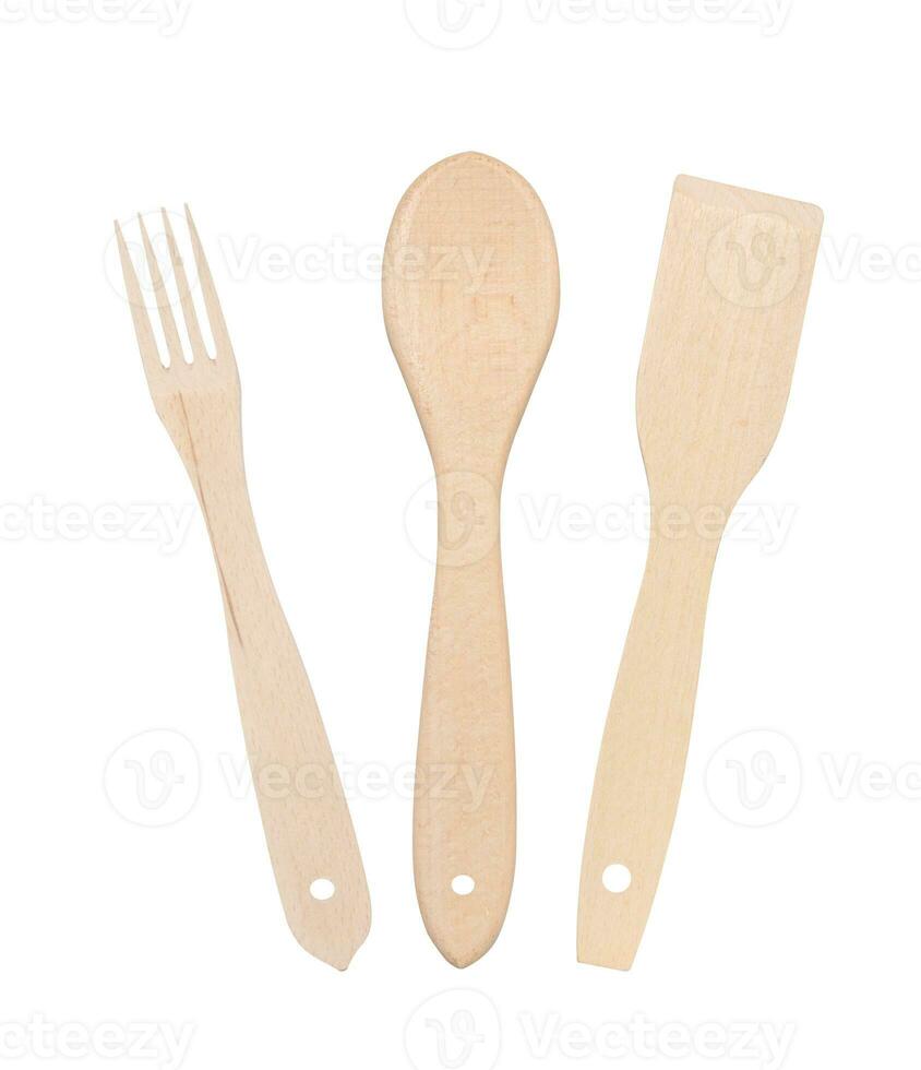 Wooden spoon, fork and spatula on a white isolated background photo