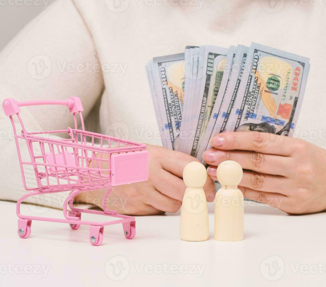 Empty miniature shopping carts on the table. Sale concept. photo