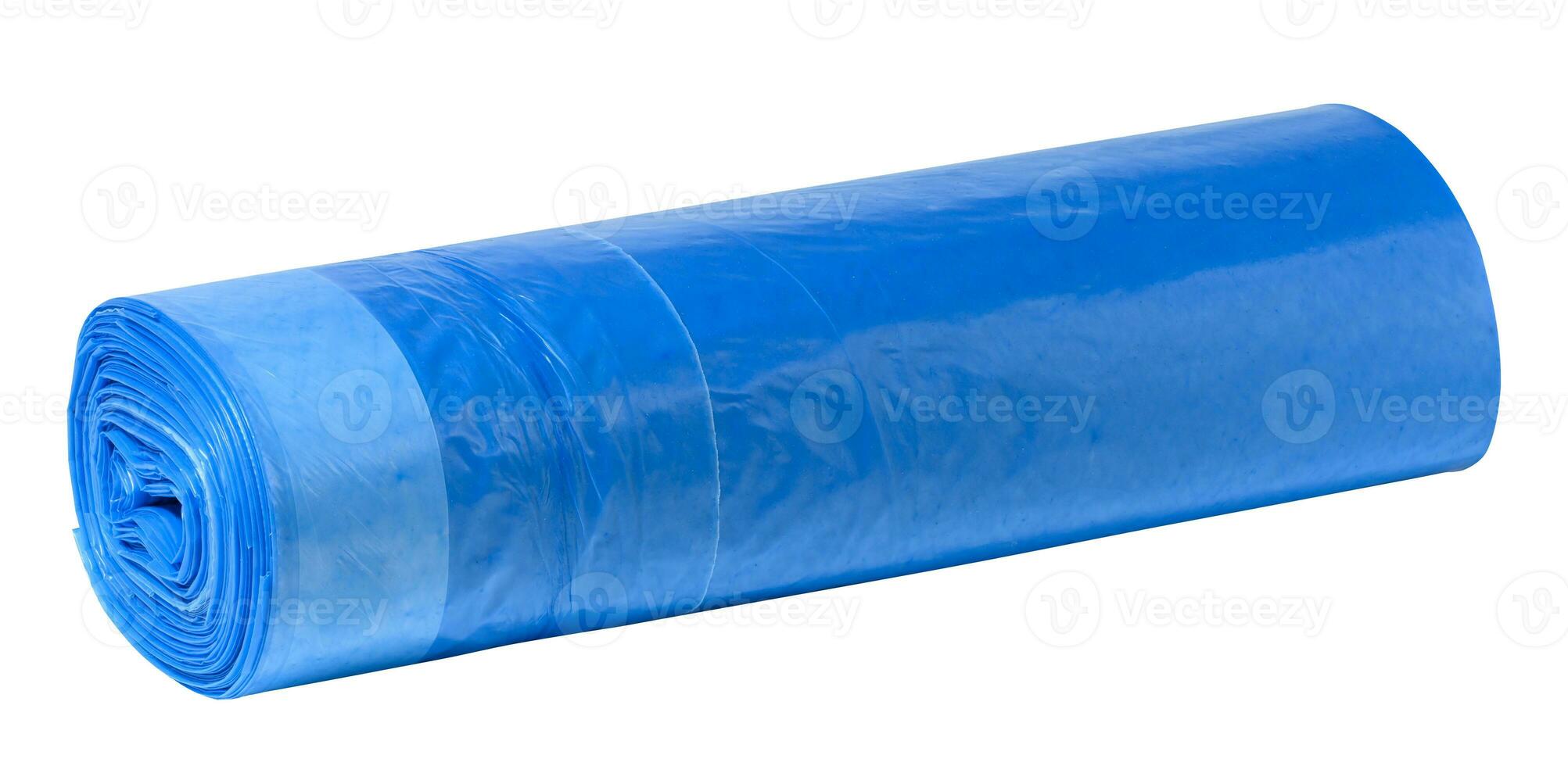 Blue plastic trash bags with strings on white background photo