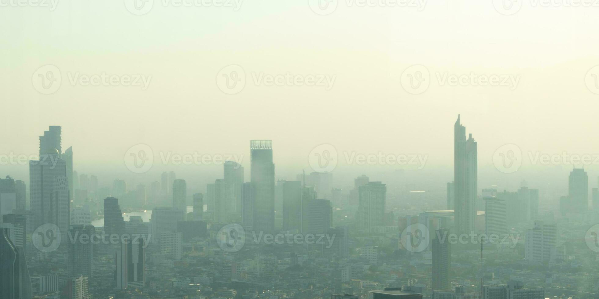 Concept of Pollution PM2.5 Unhealthy air pollution dust. Toxic haze in the city. Photos in the capital on a skyscraper.