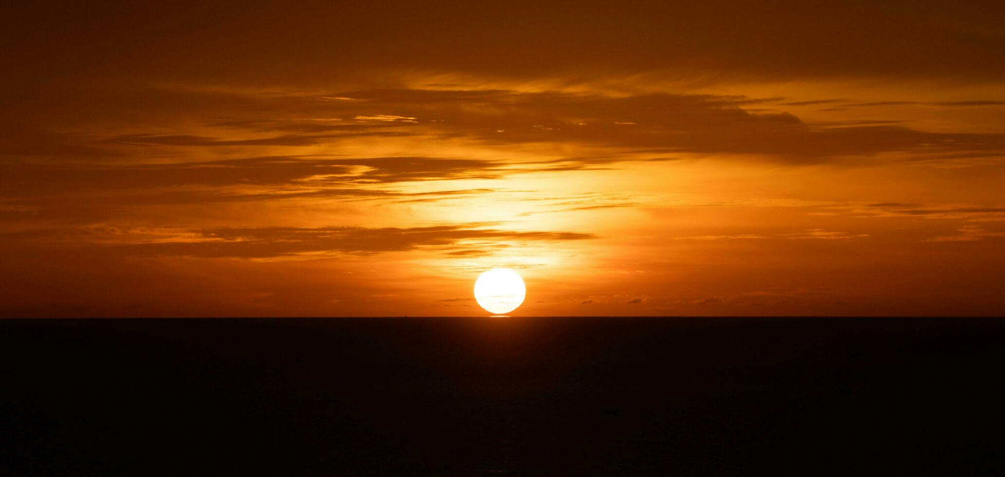 Sunset over the sea or Glowing sea sunrise. photo