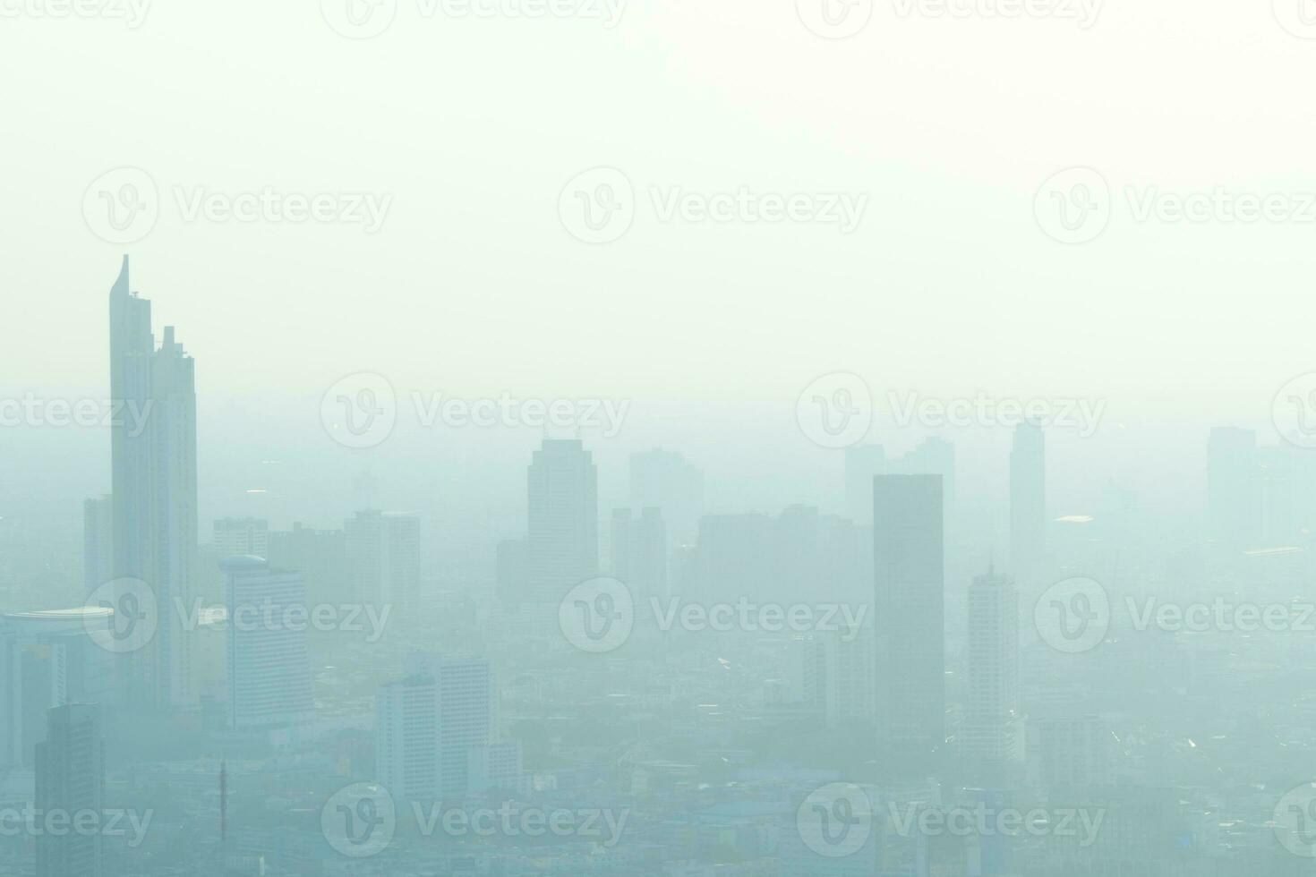 Concept of Pollution PM2.5 Unhealthy air pollution dust. Toxic haze in the city. Photos in the capital on a skyscraper.