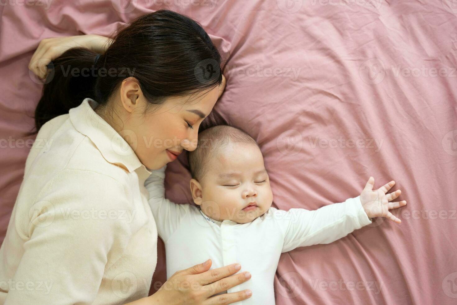 Asian mother and newborn baby feet are smiling and happy photo