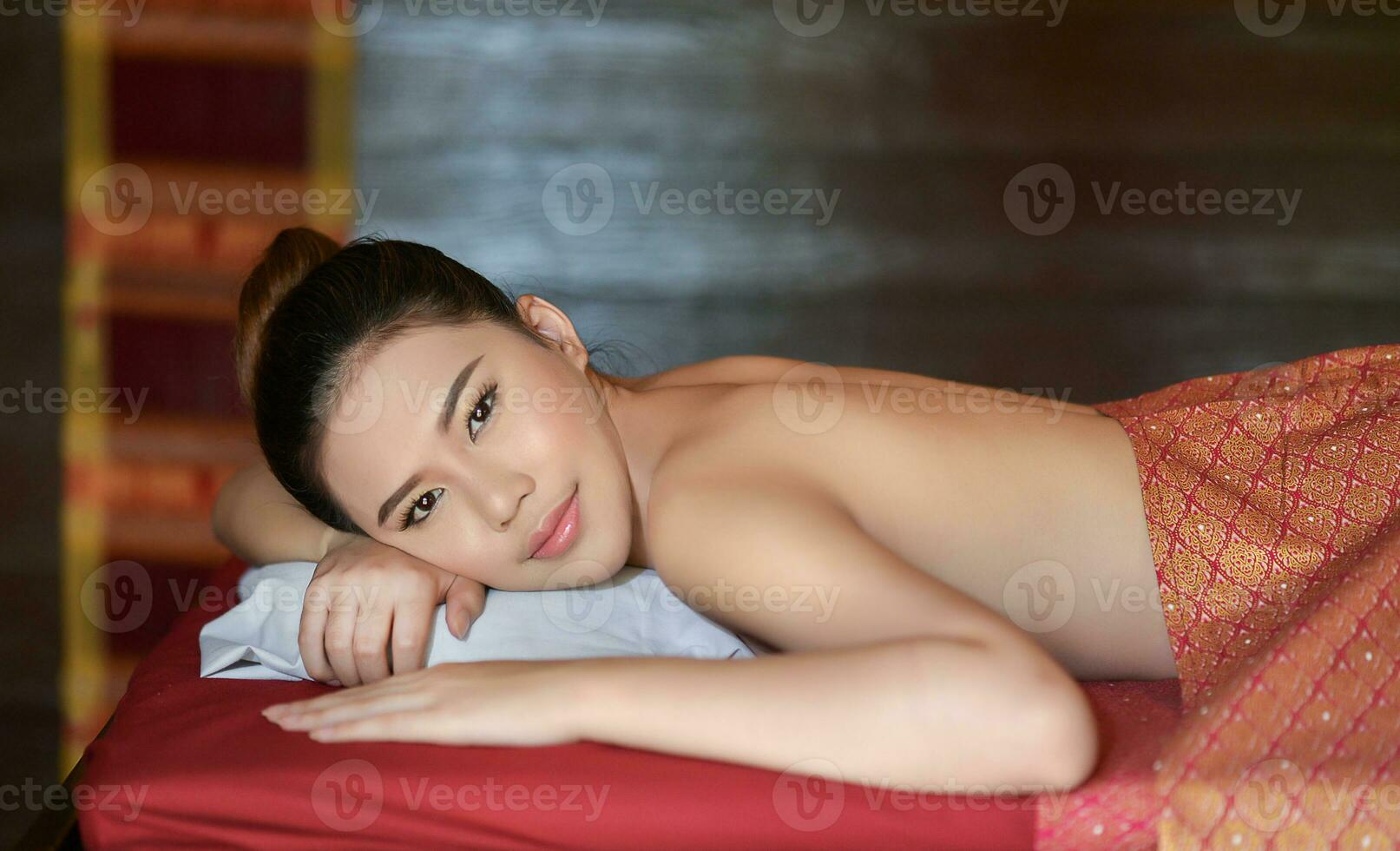 Beautiful Asian girl doing spa massage photo