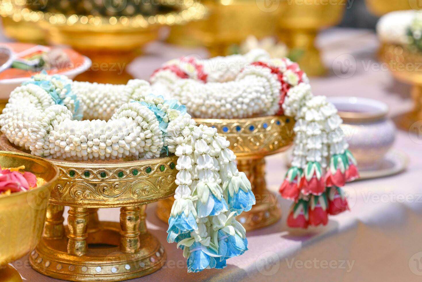 Jasmine garland on golden tray, respect and worship photo