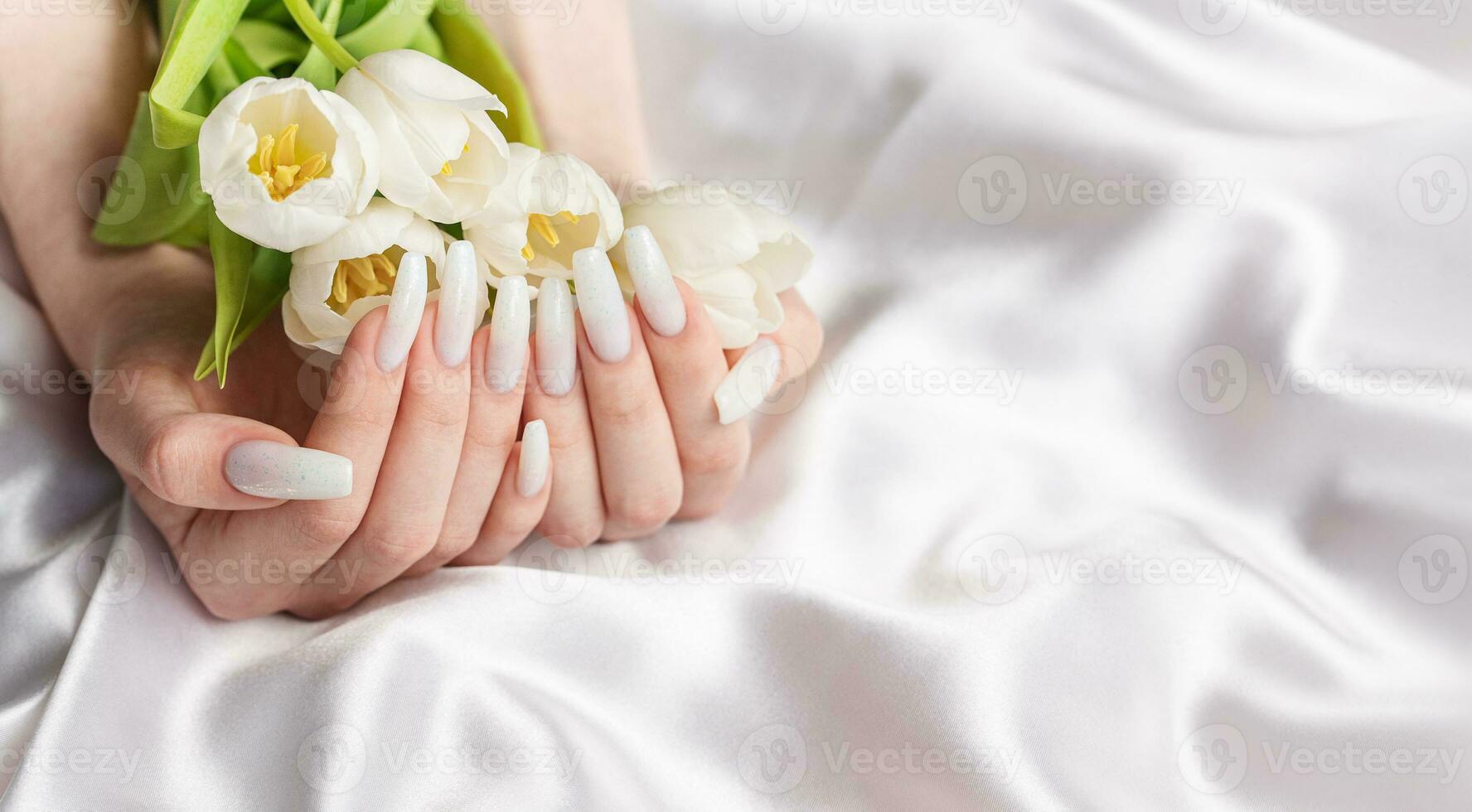 Female hand with spring nail design. photo