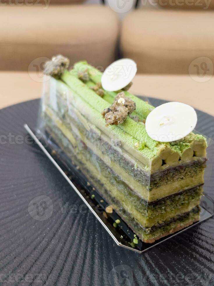 Pistachio opera cake  from homemade bakery photo