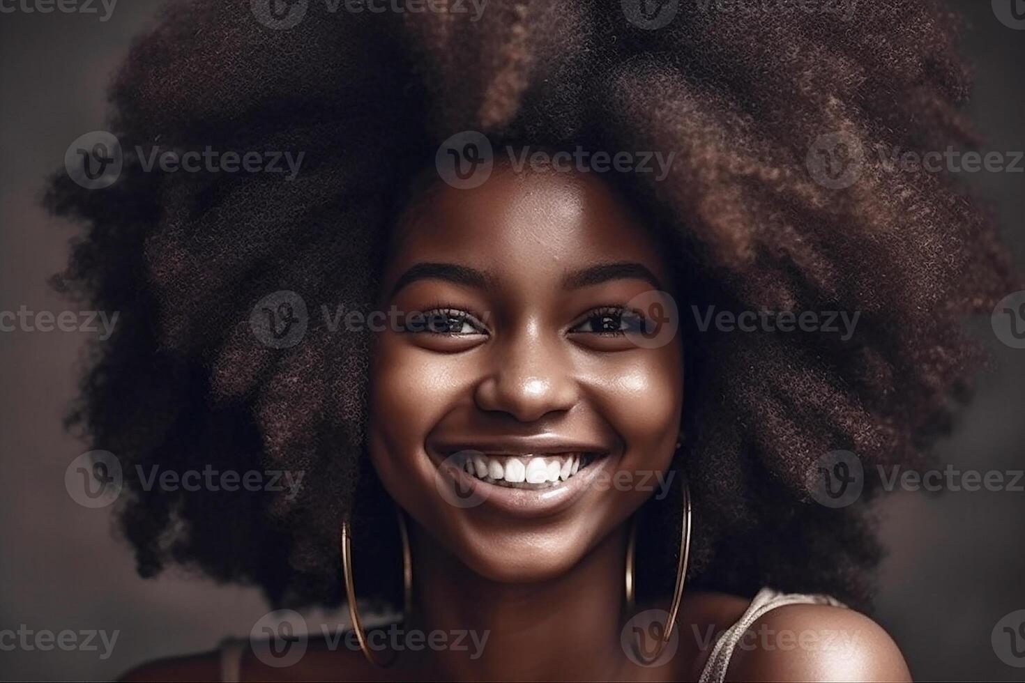 Portrait of an African smiling woman with curly hair. photo